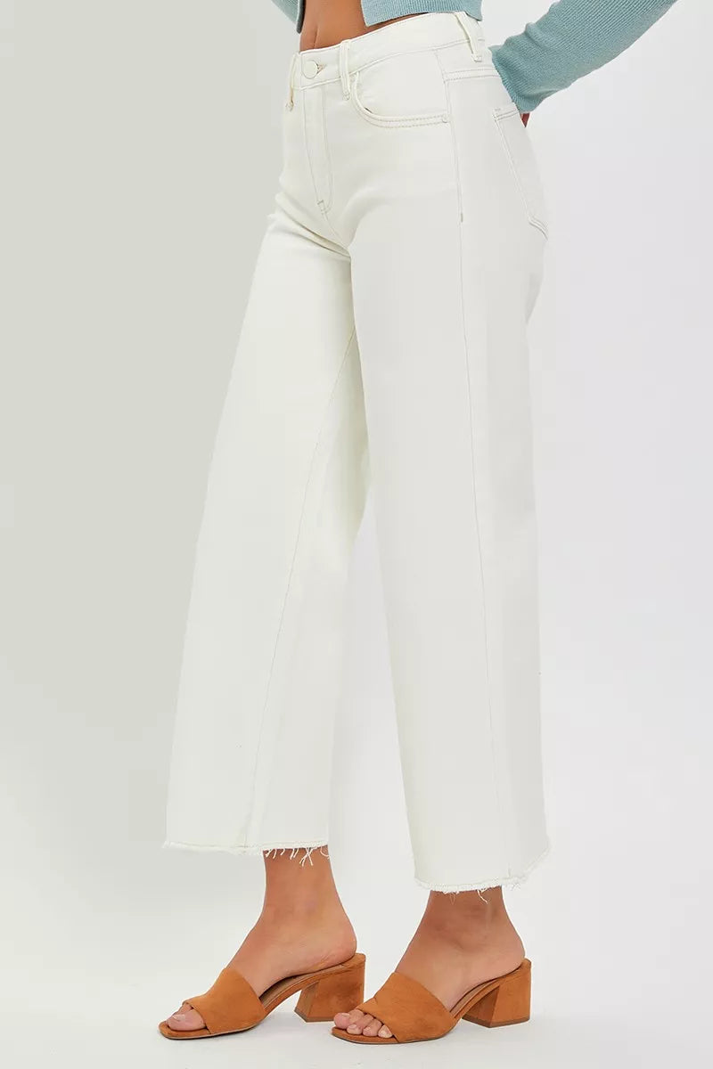 Side view of Joni Cream Tummy Control Wide Leg Crop Jeans, raw hem.