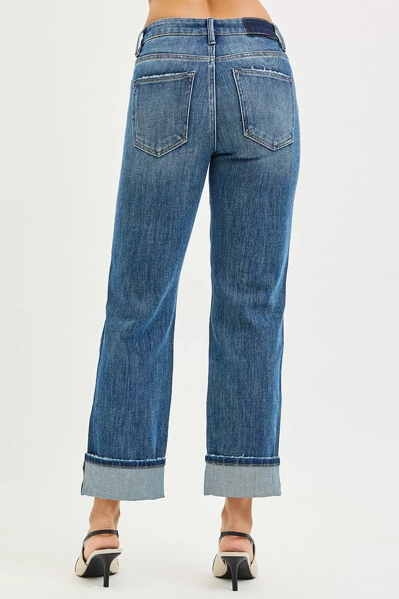 Back view of Cara Slouchy Straight Jeans in dark wash highlighting pockets and raw cuffed hem.