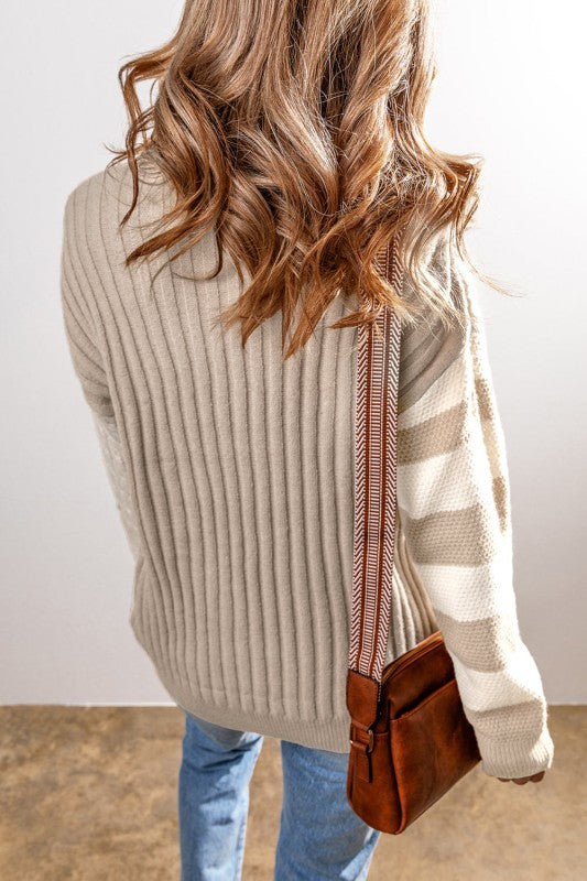 Back view of Gille Cable Knit Sweater – ribbed knit with striped sleeve detail