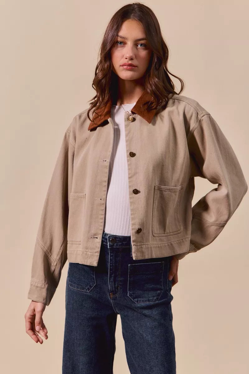 Model styling Suri Cotton Twill Cropped Barn Jacket with jeans and t-shirt for casual outfit.