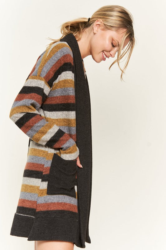 Side view of Vinni Multi Color Stripe Cardigan with earthy tones and black trim