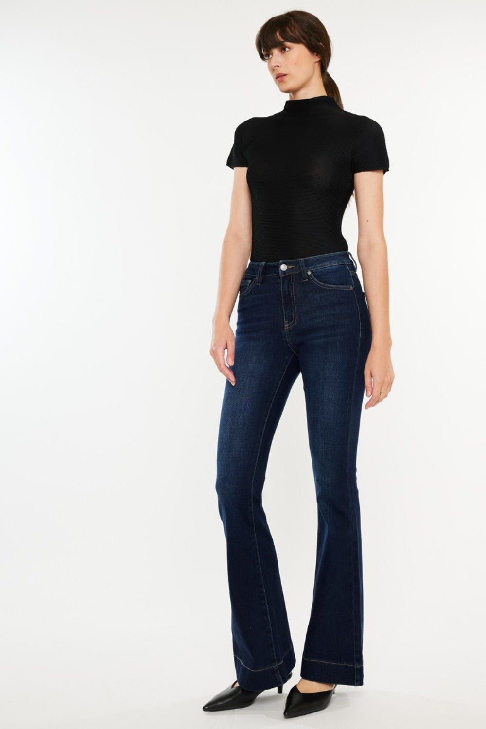 High Rise Slim Flare Jeans by Kancan in dark stone wash, slightly stretchy denim with zip fly. Non-distressed, versatile style for casual or dressed-up looks.