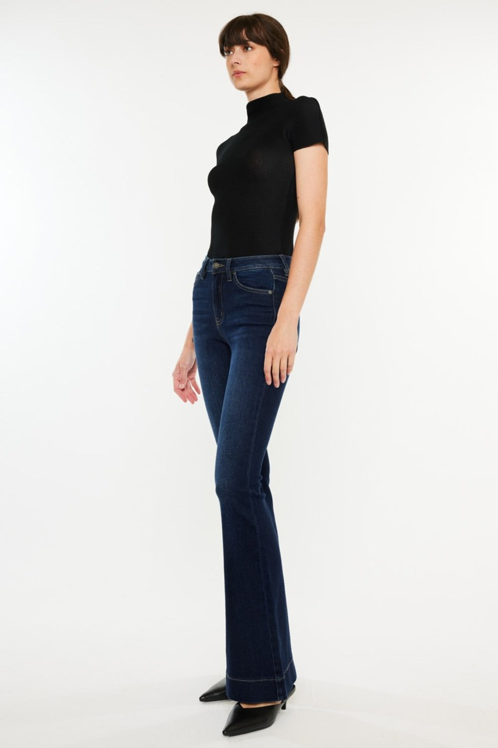 High Rise Slim Flare Jeans by Kancan in dark stone wash, slightly stretchy denim with zip fly. Non-distressed, versatile style for casual or dressed-up looks.