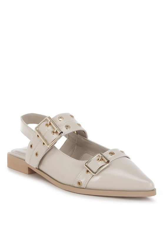 Beige flats with a pointed toe, adjustable buckle straps, eyelet detailing, and a slingback design. Features a cushioned insole and 1-inch flat heel for comfort.