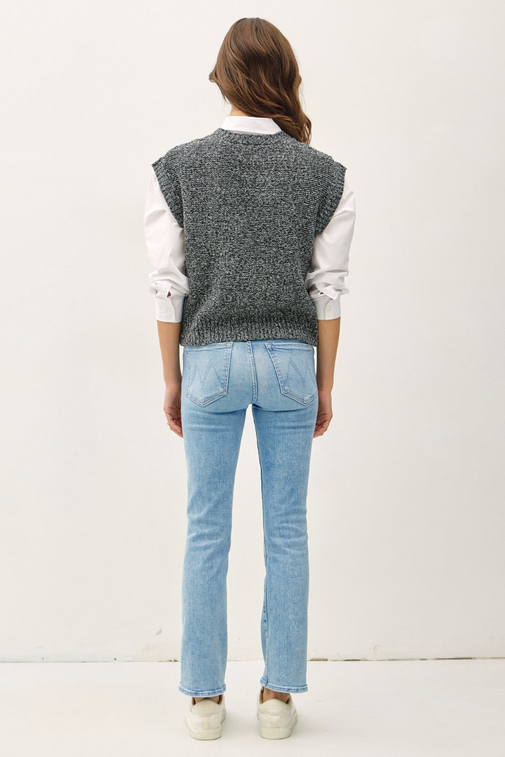 Charcoal cable-knit sweater vest with a V-neckline and cap sleeves.