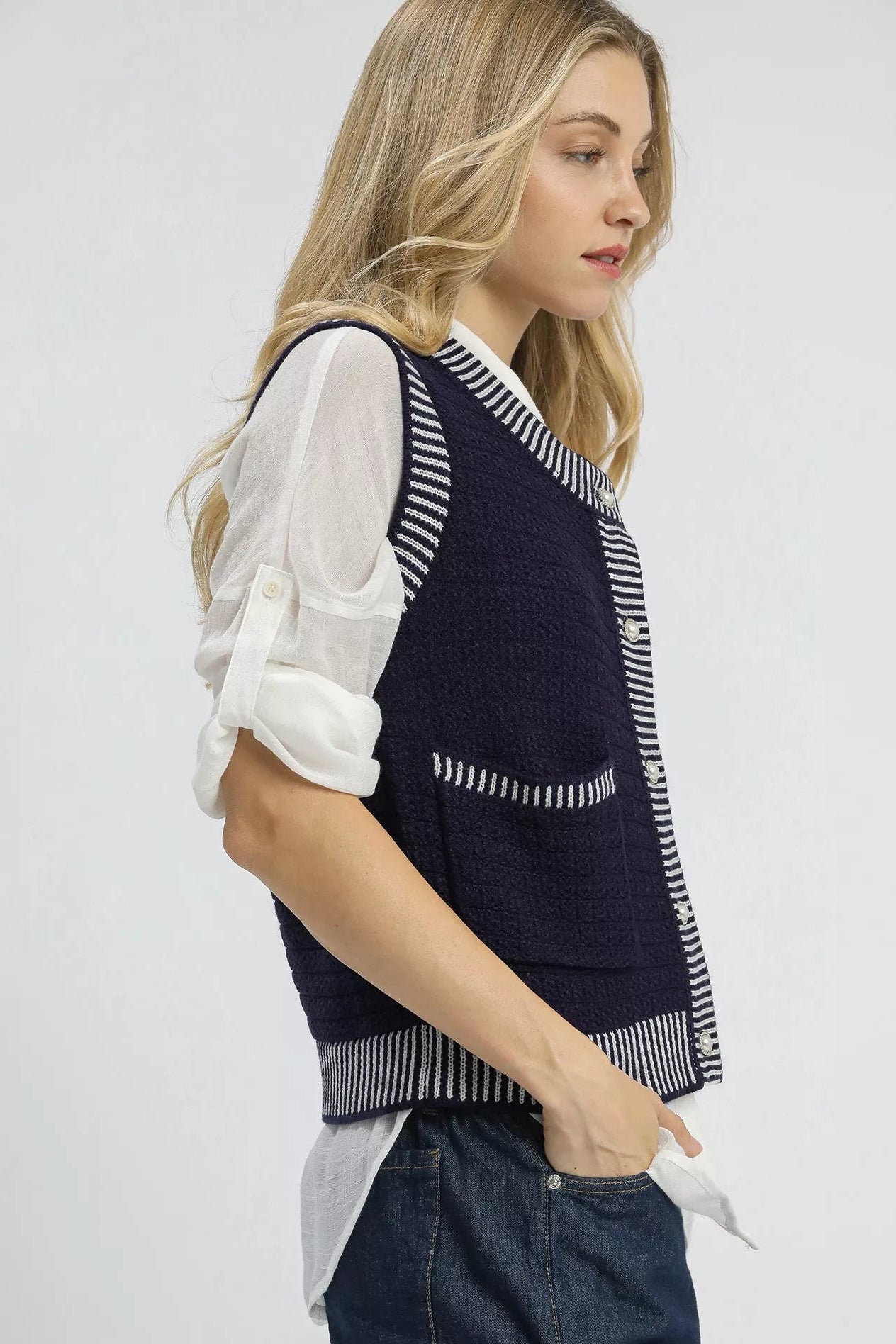 Side view of Mirren Contrast Striped Trim Sweater Vest highlighting textured knit fabric.