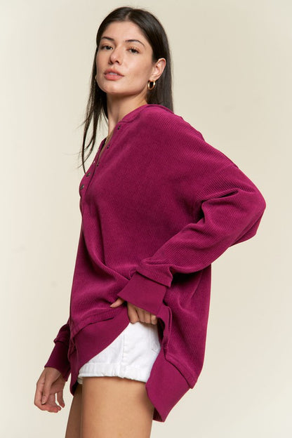 Side angle highlighting ribbed knit and relaxed drop sleeves of magenta Kenzie Plus Size Hoodie.