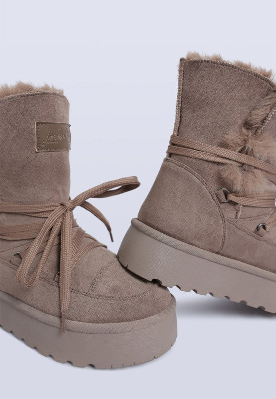 Side view of Taupe Noaya Chunky Faux Fur Snow Boots showing chunky sole and flatform heel.