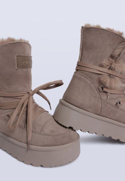 Side view of Taupe Noaya Chunky Faux Fur Snow Boots showing chunky sole and flatform heel.