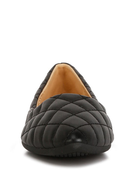Front view of black quilted ballet flats highlighting quilted pattern.