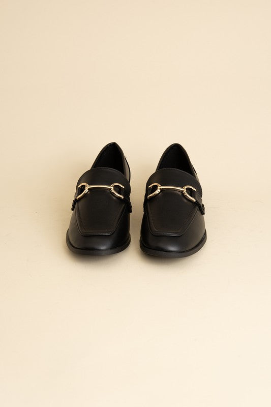 Black Horsebit Loafers with guitar motif, featuring horsebit detailing, slip-on style, and flat heel.