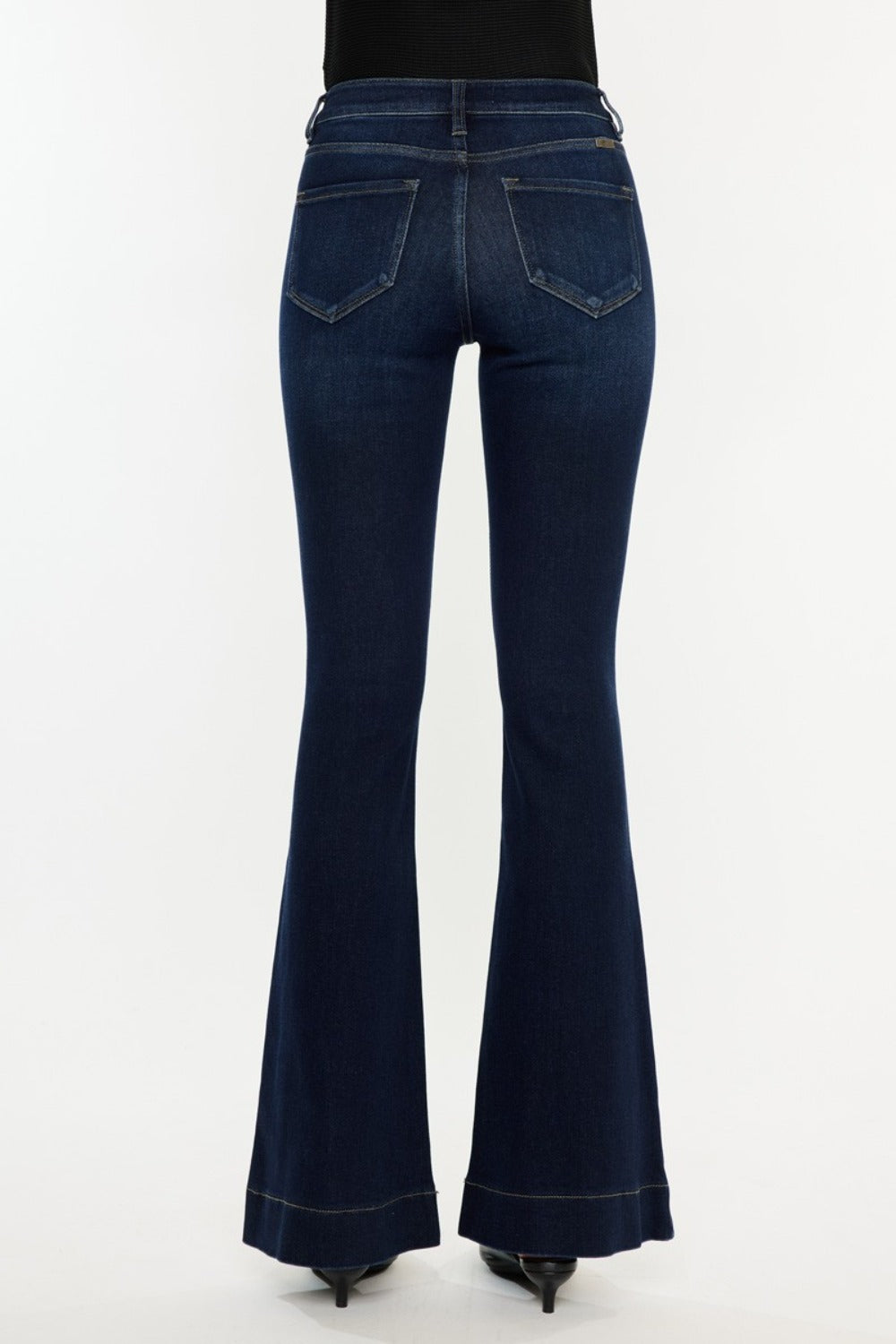 High Rise Slim Flare Jeans by Kancan in dark stone wash, slightly stretchy denim with zip fly. Non-distressed, versatile style for casual or dressed-up looks.