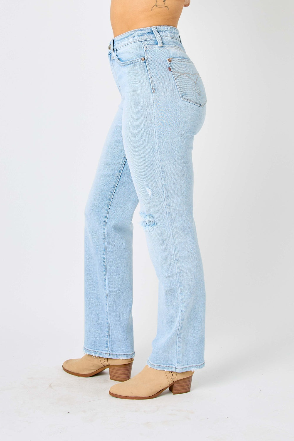 High waist distressed straight jeans in light wash. Slightly stretchy with a zip fly closure.