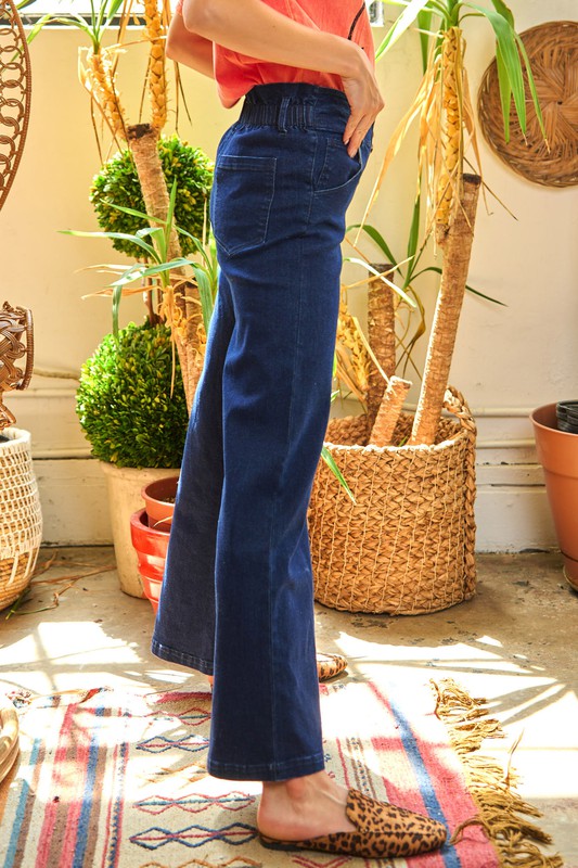 Dark wash high-waisted wide-leg jeans with a vintage-inspired 6-button fly and stretch denim for a flattering fit.