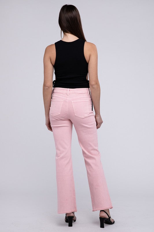 Pink acid-washed straight wide-leg pants featuring a frayed cutoff hem, zip fly closure, and a relaxed fit. Made with stretchy fabric for comfort and a unique vintage-inspired look.