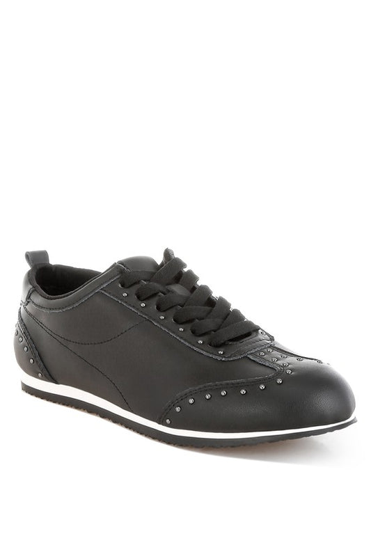 Black Odaya Studded Leather Sneakers by Rag Company, side angle view showing stud embellishments and contrast sole.