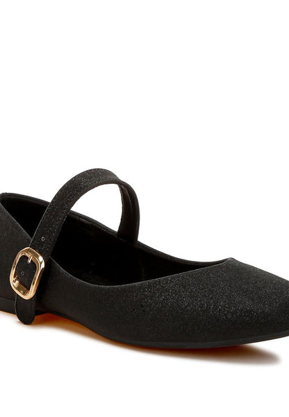 Close-up of black glitter ballerinas with pin buckle strap and cushioned insole.