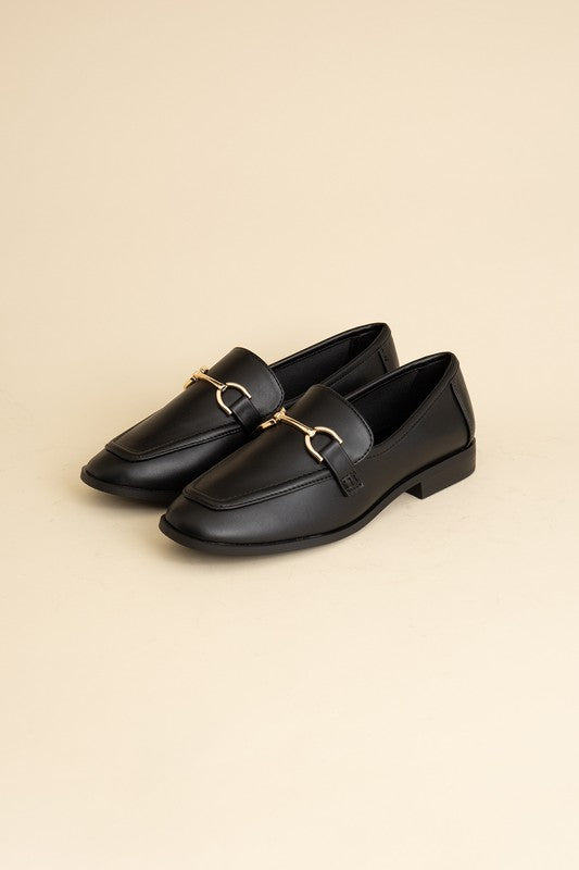 Black Horsebit Loafers with guitar motif, featuring horsebit detailing, slip-on style, and flat heel.