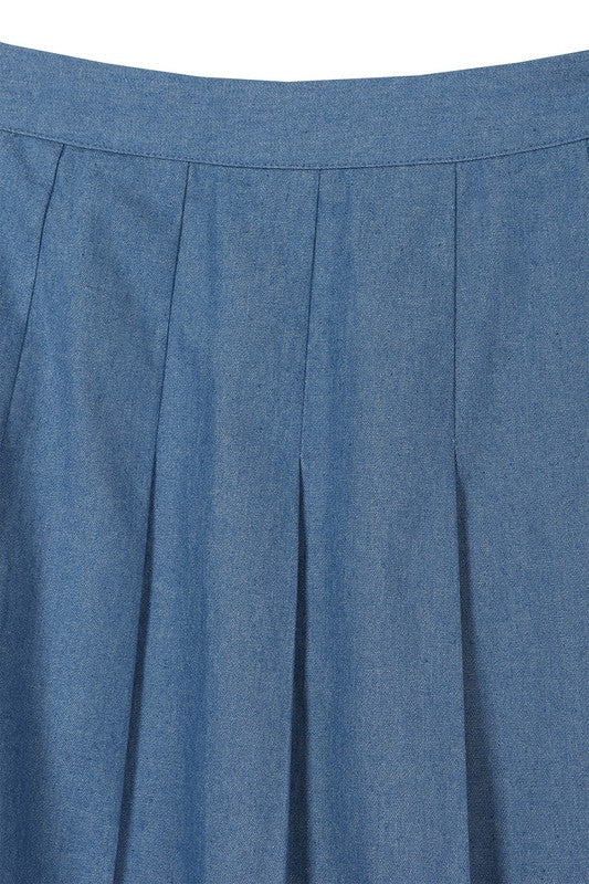 Blue high-waist, pleated, mini tennis skirt, with back zipper closure.