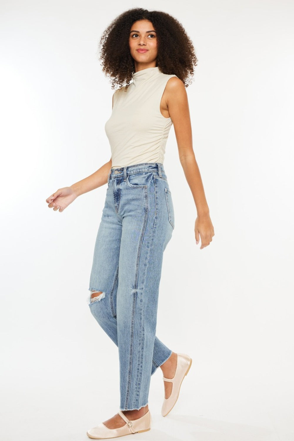 Ultra High Rise Distressed Straight Jeans in medium stone wash with distressing, raw hem, and 90s-inspired boyfriend fit. Slightly stretchy with a 5-pocket design and zipper fly.