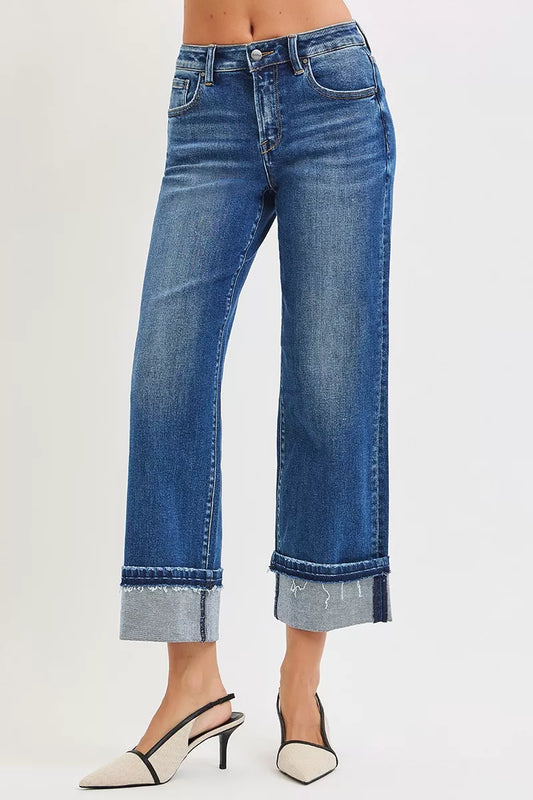 Close-up of Vera Mid Rise Straight Jeans showing raw cuffed hem detail.
