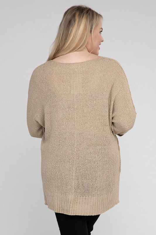 Oatmeal plus size crew neck sweater with a loose fit, side slits, long sleeves, and a cozy knit fabric for warmth.