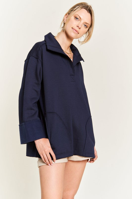 Aylani Plus Size High Collar Knit Top navy front view with pockets