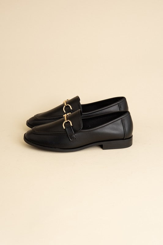 Black Horsebit Loafers with guitar motif, featuring horsebit detailing, slip-on style, and flat heel.