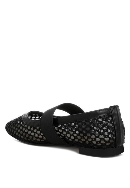 Inside side angle of Black Nayela Flats with strap and flat heel design.
