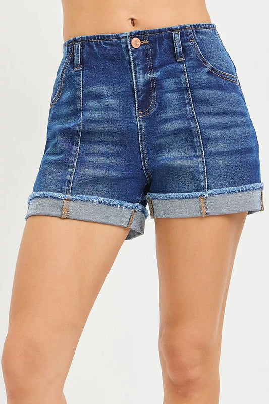 Jovie slouchy cuffed shorts close-up with dark wash denim, raw hems, and rolled cuff detail