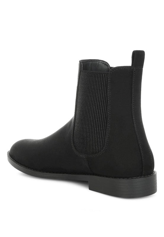 Back angle of Ayasa Low Block Heel Chelsea Boots in Black with pull tab and stacked heel