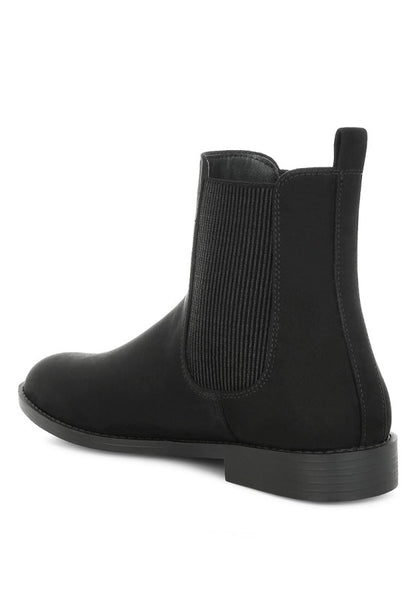Back angle of Ayasa Low Block Heel Chelsea Boots in Black with pull tab and stacked heel