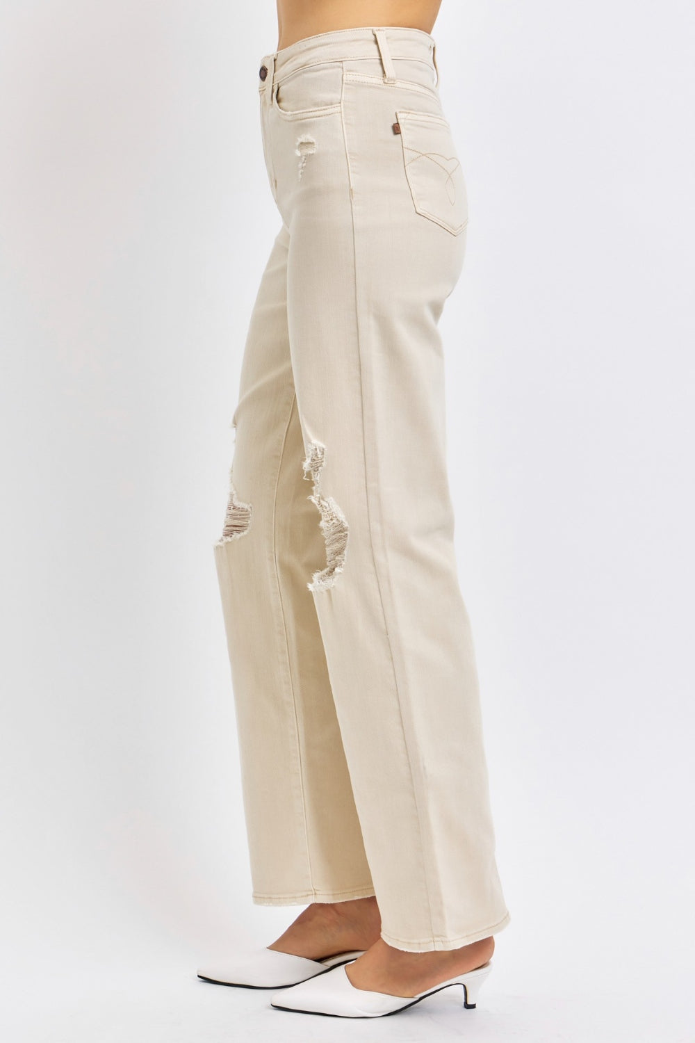 Bone-colored high-waisted wide-leg jeans with distressed details pockets, stretch denim with zip fly.