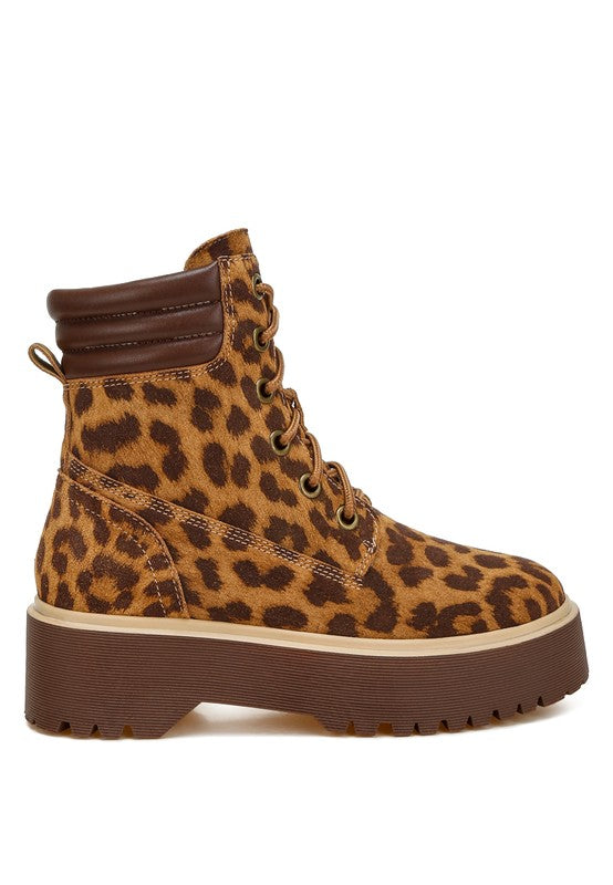 Leopard print high-ankle suede boots with a quilted collar, lace-up design, round closed toe, and low block platform heel. Features cushioned insoles and a durable lug sole.