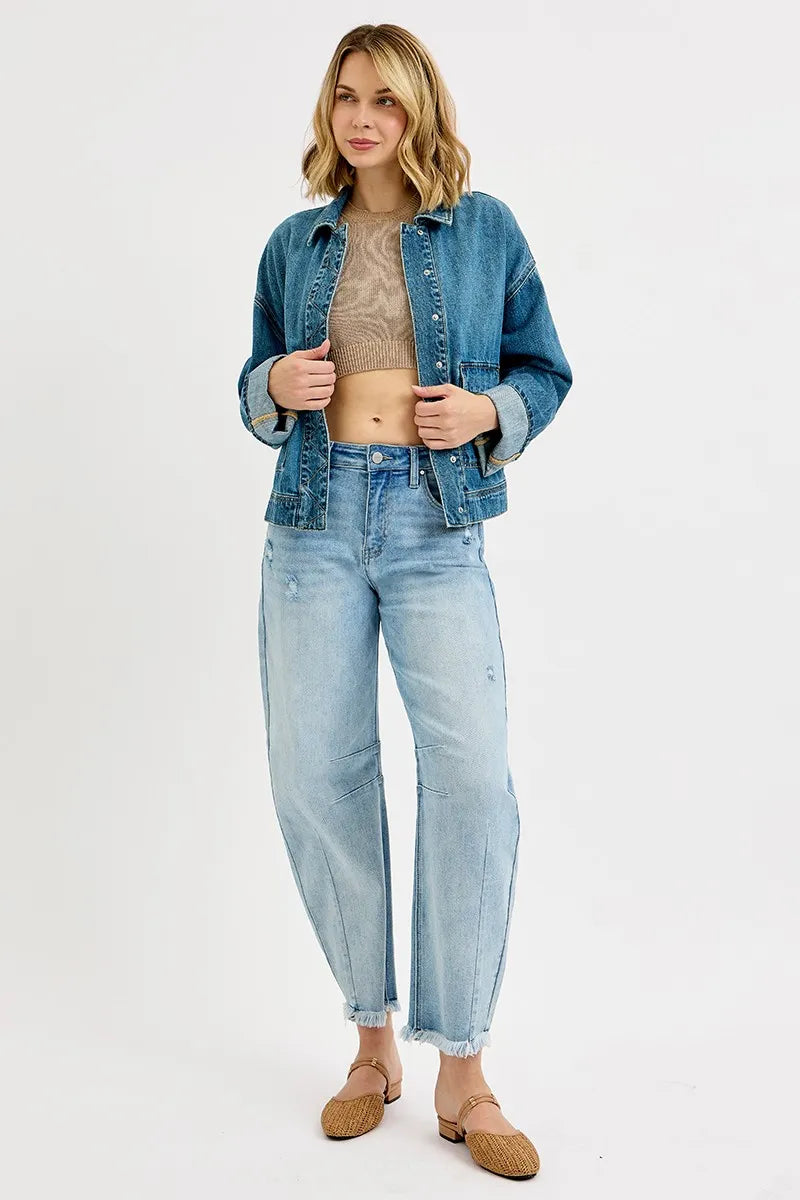 Cuffed-sleeve oversized denim jacket with cargo pockets, perfect for year-round layering.
