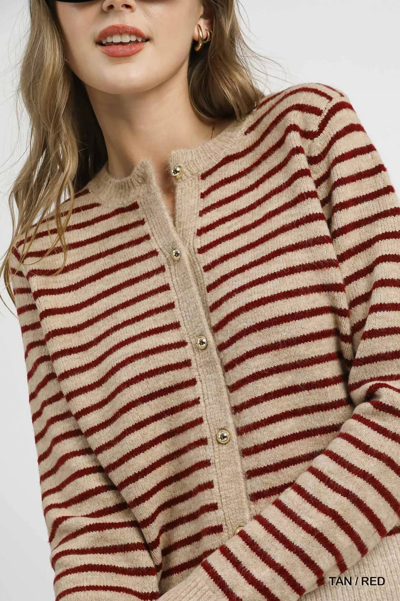 Tan red striped cardigan, ribbed collar detail close-up knit texture.