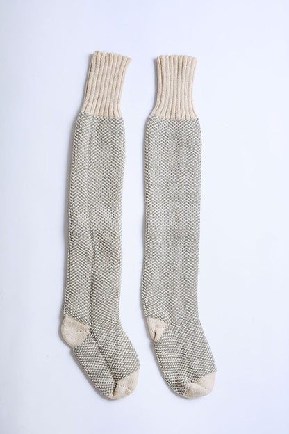 Flat lay of oatmeal Jerica Lounge Socks showing knitted open-work design.
