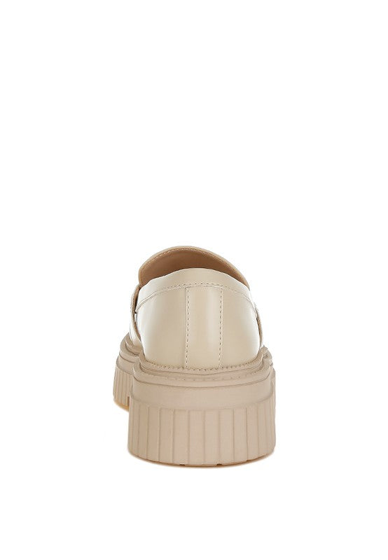 Rear view of beige Grosbeak Chunky Loafers with low block heel.