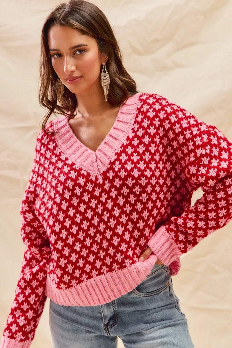 Model wearing Chloe red pink oversized V-neck sweater casual fall outfit.