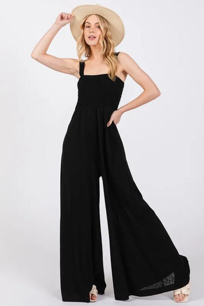 Stylish Sleeveless Jumpsuit Featuring a Smocked Bodice and Flowy Wide Legs - Ideal for Effortless Elegance.