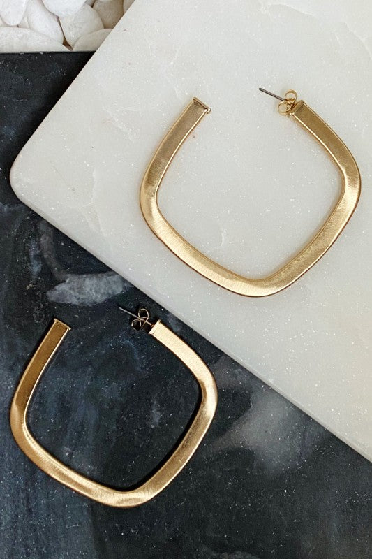 Overall Luxe Square Hoop Earrings on Ellison + Young card; satin gold-plated finish and open square silhouette.