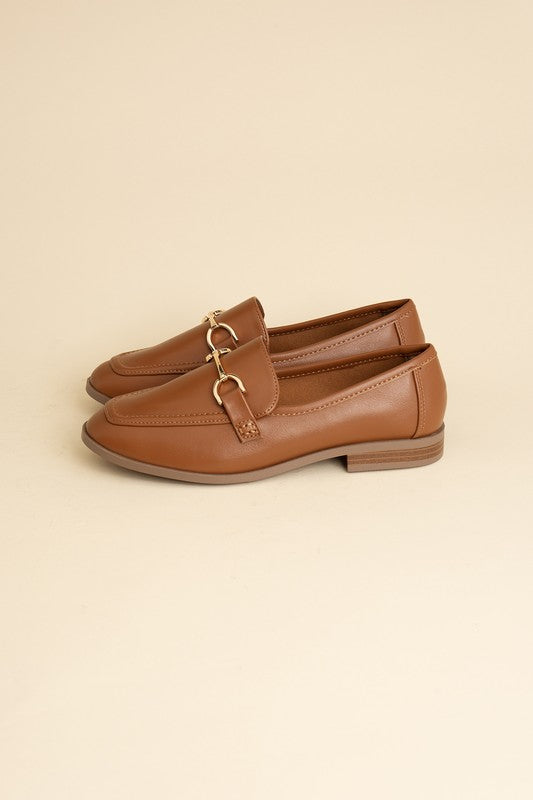 Cognac Horsebit Loafers with guitar motif, featuring horsebit detailing, slip-on style, and flat heel.