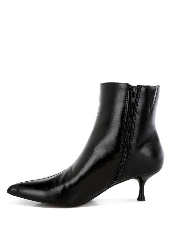 Black faux leather kitten heel boots with a closed point toe, 2.5-inch heel, and zipper fastening. Features paneling detail, elasticated gussets, and comfortable cushioned insoles.