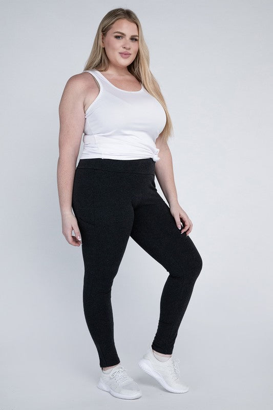 Full-length curvy plus leggings in black with a high-rise thick waistband, fitted silhouette, and convenient leg pockets.