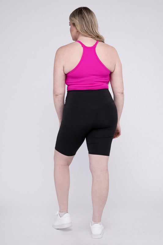 High-rise plus-size athletic biker shorts in black, featuring a fitted silhouette and seamless design for comfort and flexibility.