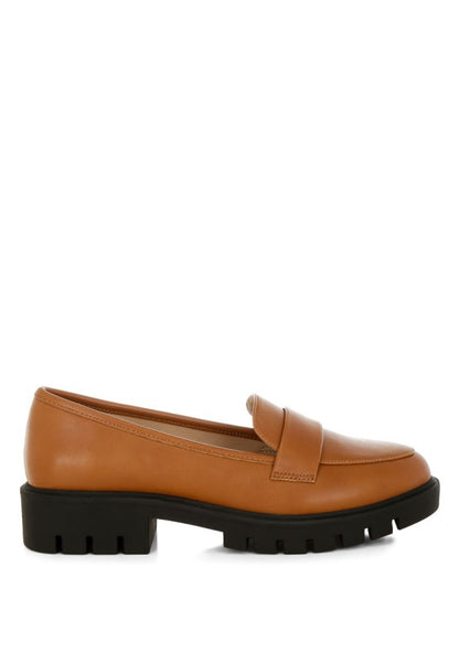 Peridot Chunky Loafers in tan side view showing sleek silhouette and platform heel design.