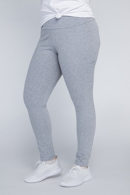 Full-length curvy plus leggings in Heather gray with a high-rise thick waistband, fitted silhouette, and convenient leg pockets.