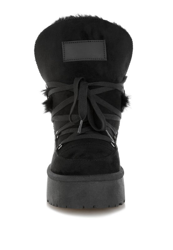 Close-up of Black Noaya Chunky Faux Fur Snow Boots highlighting faux fur trim and stitching.