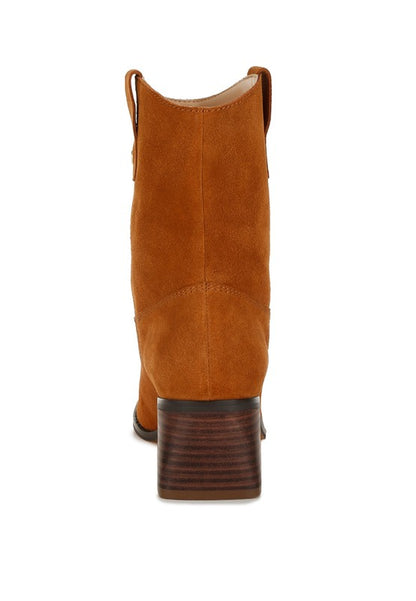 Rear view showing stacked wooden heel and pull tabs on tan Emberly ankle boots.