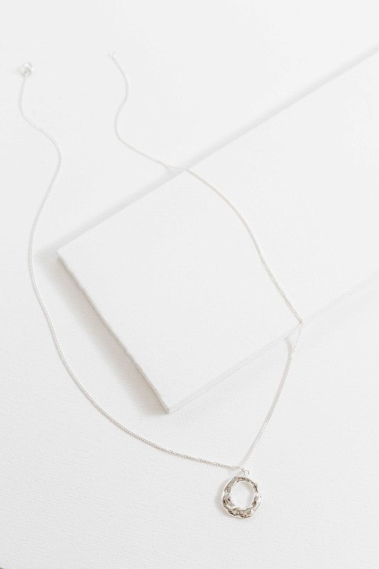 Flat lay showing full length of Charming Circle Necklace in Silver